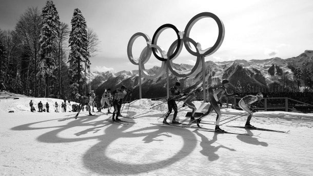 SOCHI, RUSSIA - FEBRUARY 19:  (R-L) Emil Joensson of Sweden, Iivo Niskanen of Finland, Maciej Kreczmer of Poland and Simeon Hamilton of the United States lead a group past the Olympic rings as they compete in the Mens Team Sprint Classic Semifinals during day 12 of the 2014 Sochi Winter Olympics at Laura Cross-country Ski & Biathlon Center on February 19, 2014 in Sochi, Russia.  (Photo by Richard Heathcote/Getty Images)