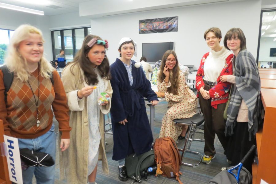 Margaret Lachapelle (far right), Cassidy Dawkins (Second from the left), Celia Avelar (left middle), Camila Tabora (middle right), Soren/Ashman (second to the right), and Amelie Archambault (far right) are jamming it out as a group of elderly. 
