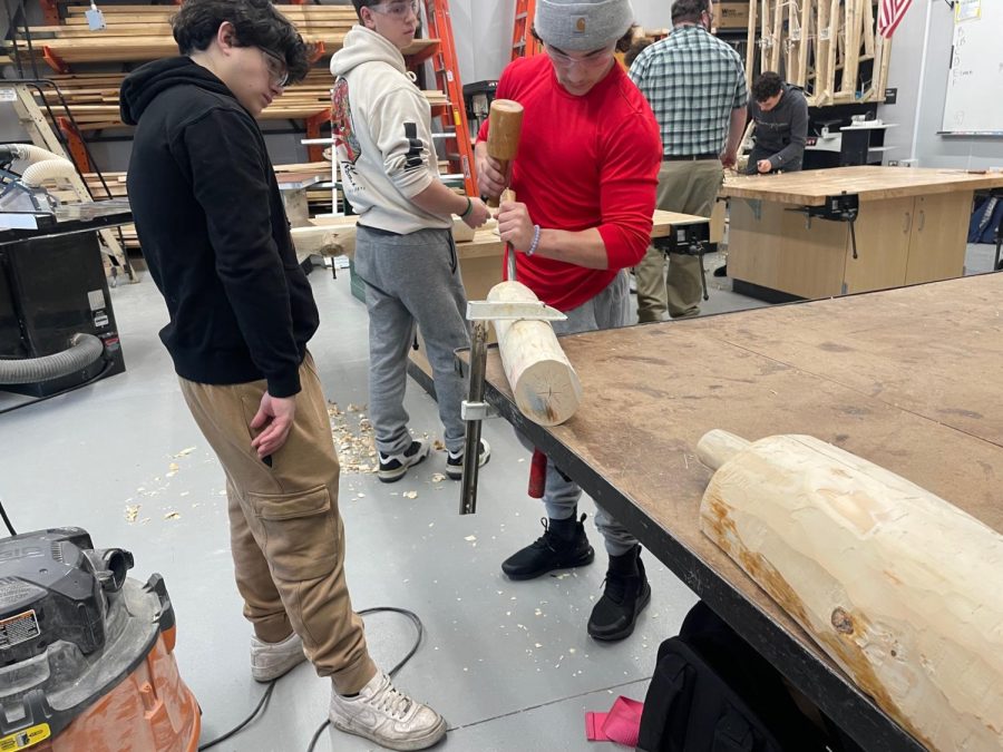Students in Mr. Grants construction class build a project designed by Mr. Gervais class. The structure will be on display at the RI Home Show this week.