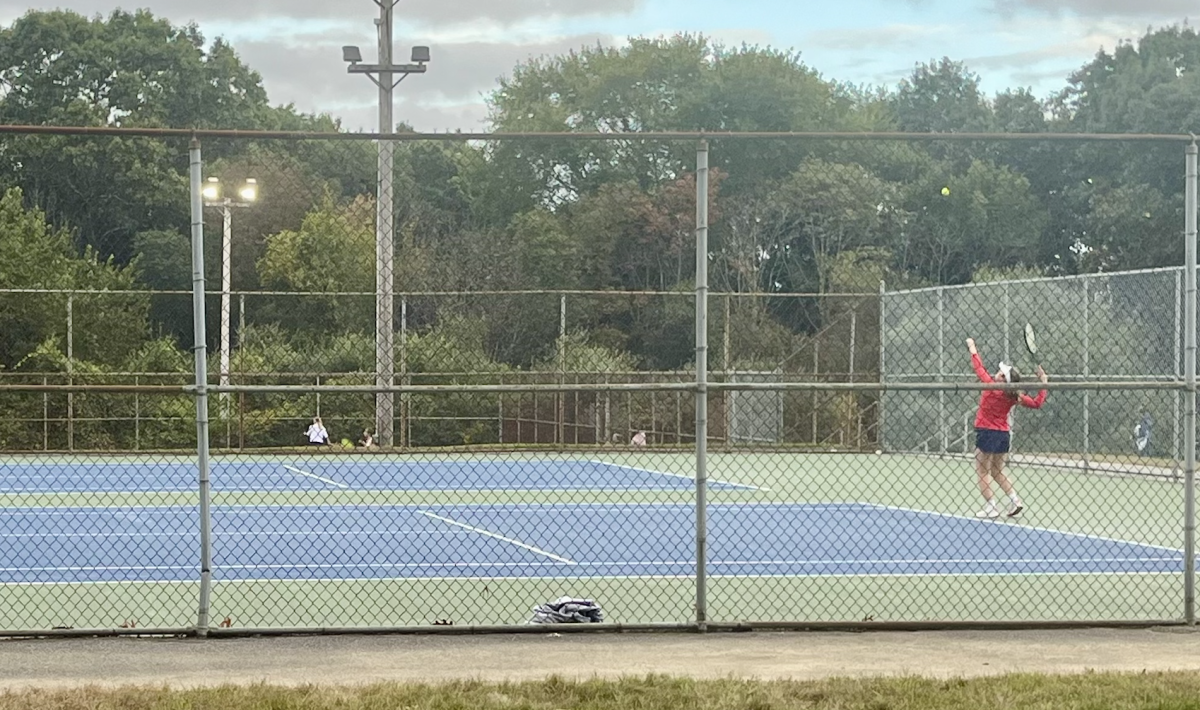 #1 singles player sophomore Anna Danis prepares to serve