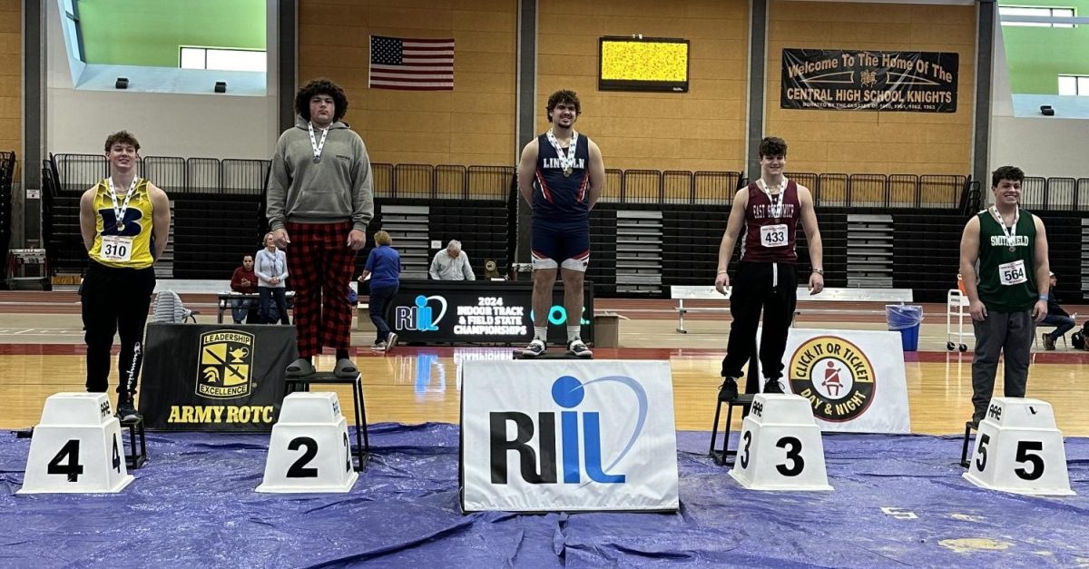 Tyler Durang stands at the first place podium at a competition last year