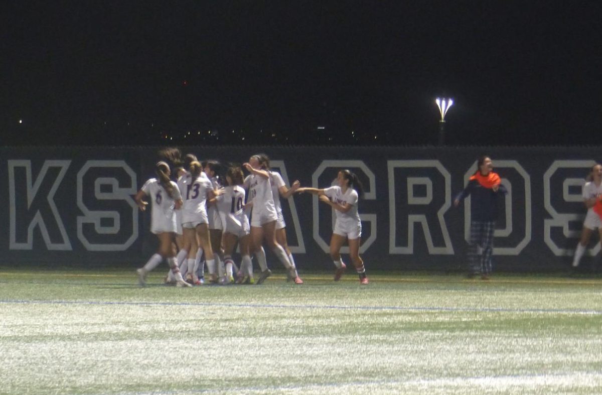 The girls celebrate after one of their goals