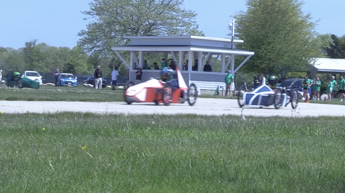 Lincoln's engineering car (red) races alongside Lincoln's physics car (blue)
